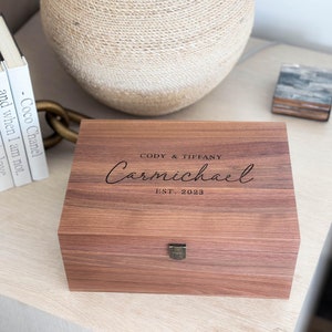 Personalized walnut keepsake box with latch and hinge.