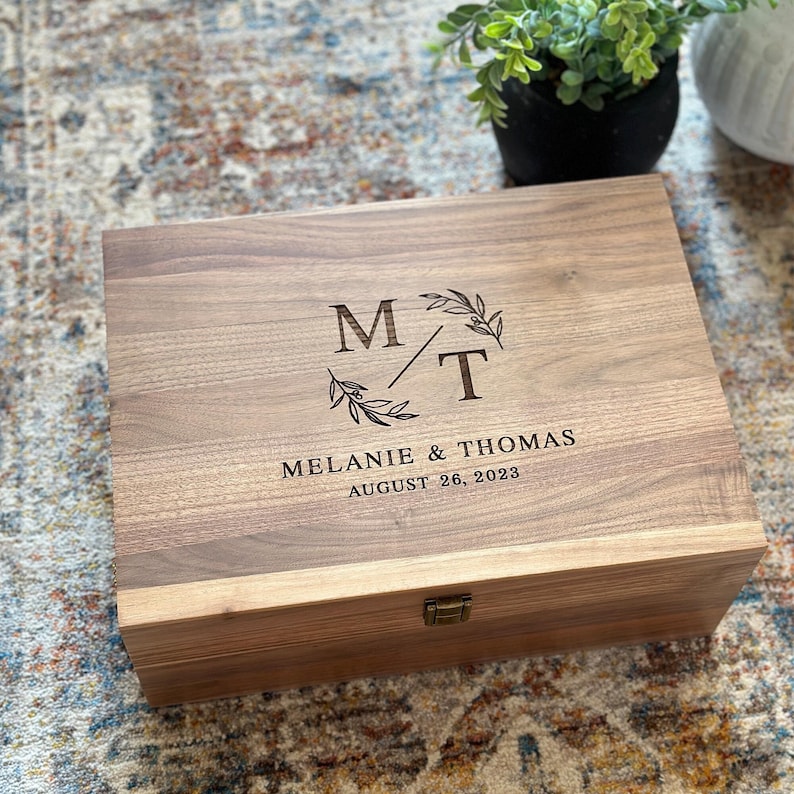 Personalized walnut keepsake box with latch and hinge.