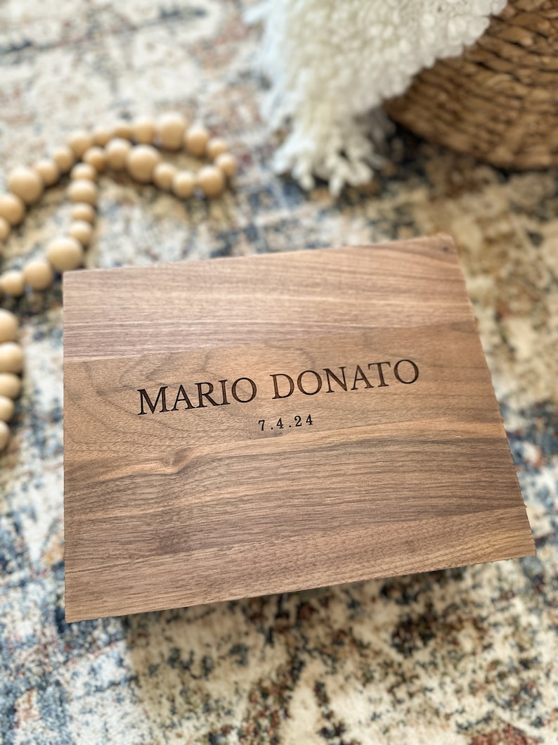 May include: A wooden box with the name "MARIO DONATO" and the date "7.4.24" engraved on the top.