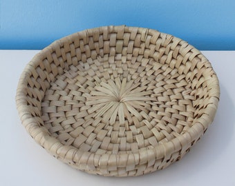 Swazi basket 34 x 6cm: Yellow-cream lusundvu grass are woven together to create a basket useful in the home for fruit or general storage