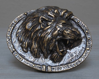Brass African lion belt buckle: the fearsome African lion is depicted on these buckles, its head in relief and looking straight out