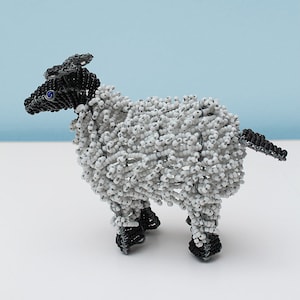 Wire and beaded sheep: The fluffiness of a sheep in pose is artfully illustrated in this fetching and very cute wire and beaded rendition