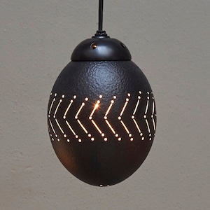 Ostrich eggshell pendant light available in natural or black: with geometric cut-out designs are sure to impress