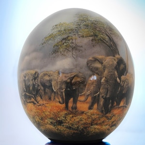 Elephant decoupage ostrich eggshell: A majestic herd of African elephants stare out of this beautifully painted decoupage ostrich eggshell