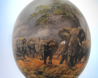 Elephant decoupage ostrich eggshell: A majestic herd of African elephants stare out of this beautifully painted decoupage ostrich eggshell