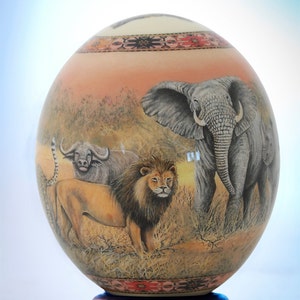 Decoupage Big 5 ostrich egg: this ostrich eggshell piece has been transformed by skilful decoupage depicting Africa&#39;s magnificent Big 5