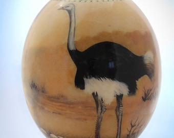 Decoupage ostrich egg: The ubiquitous ostrich in all of its plumed glory struts it stuff on the front of this unique African decor item