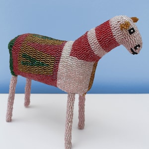 A multi-coloured beaded horse: This artfully beaded horse on a wire frame will brighten up any room with its dazzling mix of colours