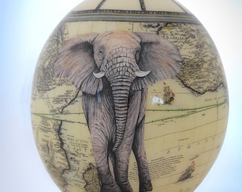 Decoupage Elephant ostrich egg: The majestic African elephant poses in all its glory on the exquisitely painted ostrich eggshell piece