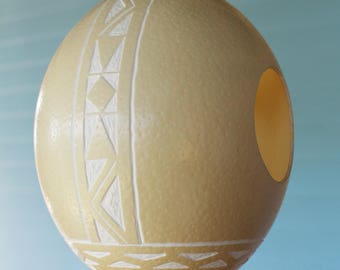 Ndbele handcrafted ostrich eggshell birdfeeder: These feeders attract all types of birds and is perfect for the extremes of outdoor weather