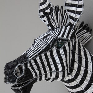 African zebra wallpiece in beads and wire: The African zebra is portrayed in this lustrous beaded and wire-framed wall piece