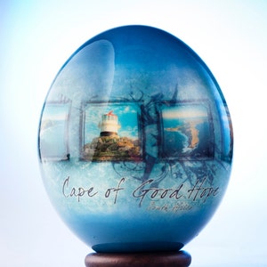 Decoupage Cape of Good Hope ostrich egg: the famous lighthouse at the Cape Point in South Africa is decoupaged on an ostrich eggshell