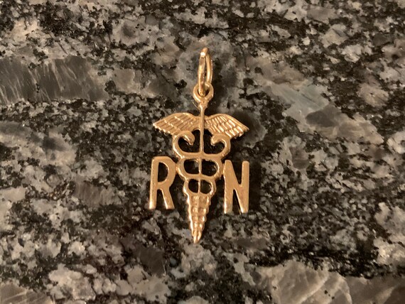 10k yellow gold Registered Nurse charm or pendant.