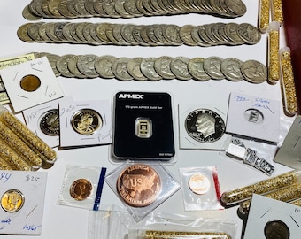 May include: A collection of gold and silver coins, including a 1/2 gram APMEX gold bar, a 1951 silver dollar, and a 1922 silver dollar. There are also several vials of gold flakes and a copper coin with the words "America US One Nation Under God".