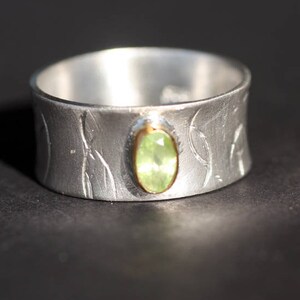 Handcrafted Peridot Ring: Sterling Silver Band with 14k Gold Bezel