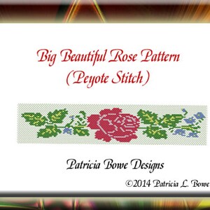 May include: A beading pattern for a red rose with green leaves and blue flowers. The pattern is called "Big Beautiful Rose Pattern (Peyote Stitch)" and is by Patricia Bowe Designs. The copyright is &copy;2014 Patricia L. Bowe.