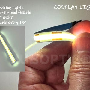 May include: Bright white solid string lights, ultra-thin and flexible, designed for cosplay. The lights are 3/16" wide and cuttable every 1.5 inches. The image also includes the text "COSPLAY LIGHTS".