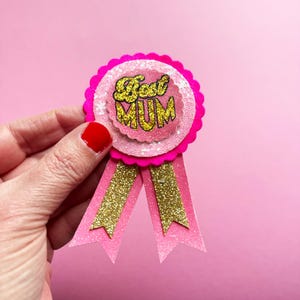Best Mum Muttertag Anstecker Rosette Baby Anstecker Rosa und Rotgold Glitzer