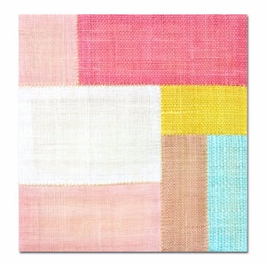May include: A patchwork of fabric squares in pink, white, yellow, brown, and blue. The fabric has a woven texture.