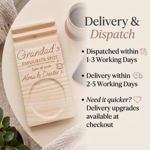 May include: A rectangular light-colored wooden coaster and phone stand featuring a grooved slot for a mobile device and a circular indentation for a mug. The wood is engraved with the text Grandad's FAVOURITE SPOT, Lots of love, and Alma & Dexter x.