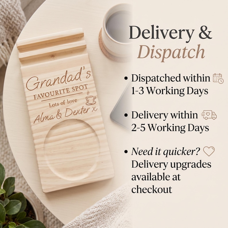 May include: A rectangular light-colored wooden coaster and phone stand featuring a grooved slot for a mobile device and a circular indentation for a mug. The wood is engraved with the text Grandad's FAVOURITE SPOT, Lots of love, and Alma & Dexter x.