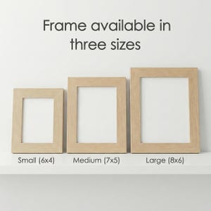 May include: Three wooden picture frames in varying sizes: small (6x4 inches), medium (7x5 inches), and large (8x6 inches). The frames are light-colored with a simple, modern design. Text above reads "Frame available in three sizes."