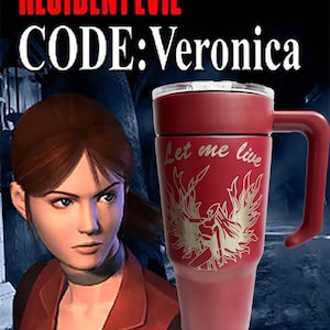 May include: A matte red insulated tumbler with a handle and a clear lid. The tumbler features an engraved graphic of a winged figure and the text Let me live. The background displays the Resident Evil Code: Veronica video game title.