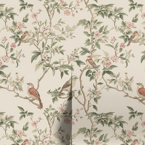 May include: A beige wallpaper with a repeating pattern of delicate green branches, pink flowers, and brown birds. The birds are perched on the branches and have a light brown body with a darker brown head and tail.