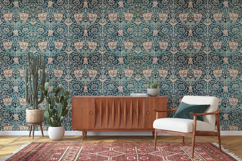 May include: A room interior featuring a teal floral wallpaper, a wooden cabinet, a white armchair, and a patterned rug. Potted cacti and succulents add a natural touch. The overall aesthetic is vintage-inspired with a modern twist.