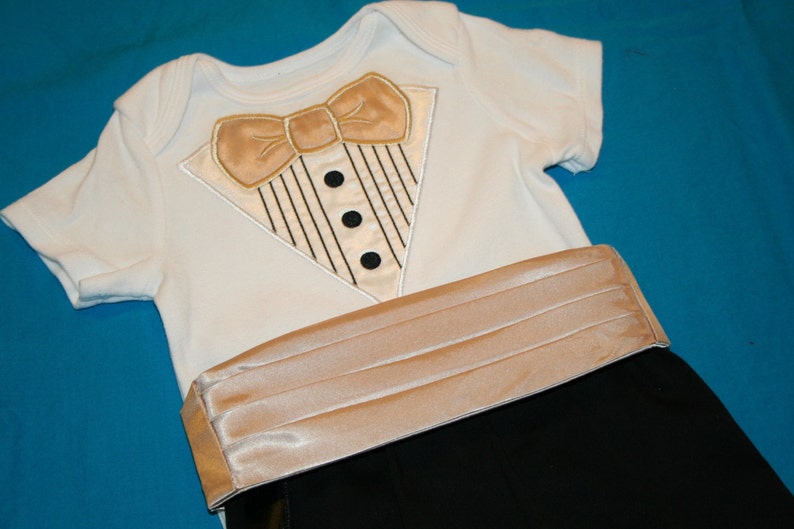 May include: A white bodysuit with a gold bow tie and a gold satin sash. The sash is pleated and has a smooth texture.