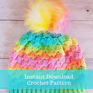 Puede incluir: Un gorro de crochet arcoíris con un pompón esponjoso. Patrón de crochet de descarga instantánea.