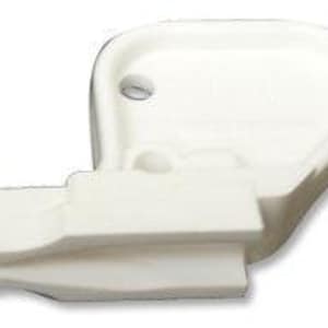 May include: A white plastic sewing machine presser foot attachment featuring a wide, curved guide arm and a flat base with a small circular opening. The component has a distinct L-shaped profile with a recessed channel for fabric alignment.
