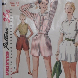 May include: Vintage Simplicity sewing pattern for a pair of shorts. The pattern is printed on a white background with red and black text. The pattern includes three different views of the shorts, each with a different style. The pattern is for size 14, bust 32.