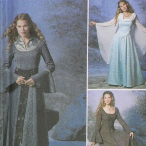 May include: Simplicity Costumes pattern featuring medieval-style dresses. The pattern includes options for long-sleeved gowns with flowing skirts and details like bell sleeves and decorative belts. The image shows the pattern number 9891.