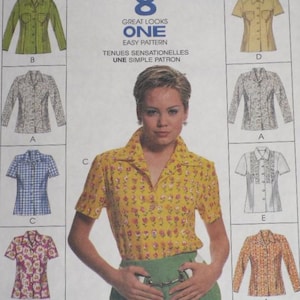 May include: A McCall's 8722 sewing pattern envelope featuring eight shirt variations. The cover displays illustrations of button-down shirts with various sleeve lengths, collar styles, and patterns, alongside a central photograph of a yellow floral shirt.
