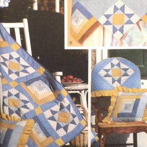 May include: A quilting pattern for a variable star and log cabin block quilt. The pattern includes instructions for making a quilt, pillow, and valance. The quilt is blue and yellow with a white background.