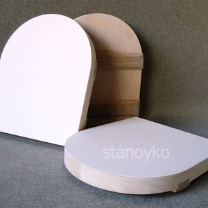 May include: Three wooden, unfinished, round-shaped, blank canvases. The canvases are different sizes and are stacked on top of each other. The largest canvas is white and the two smaller canvases are natural wood color.