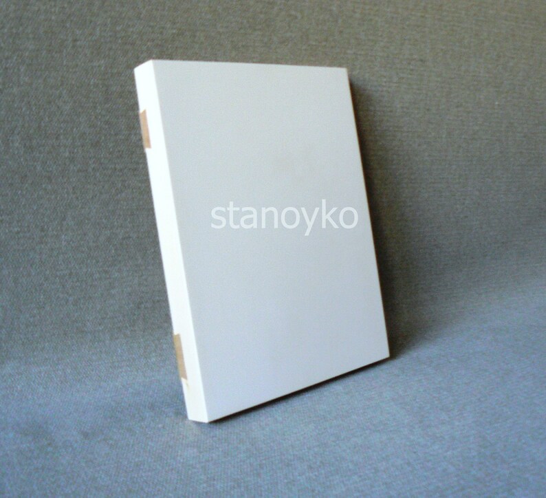May include: A white blank canvas with the word "stanoyko" printed in black on the front.