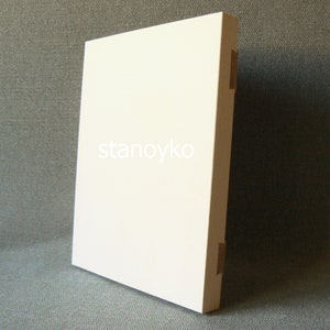 May include: A white rectangular blank canvas with the word "stanoyko" printed in the center.