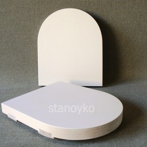 May include: Two white, round, wooden display stands. The top stand is arched and the bottom stand is flat. The bottom stand has the word "stanoyko" printed on it.