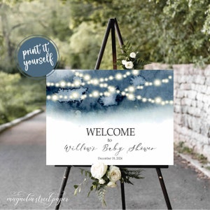 May include: A printable welcome sign for a baby shower with a watercolor background and string lights. The text reads "Welcome to Willow's Baby Shower December 19, 2024".
