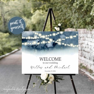 May include: A wedding welcome sign with a blue watercolor background and white string lights. The text reads "Welcome to our wedding Willow and Michael December 19, 2024".