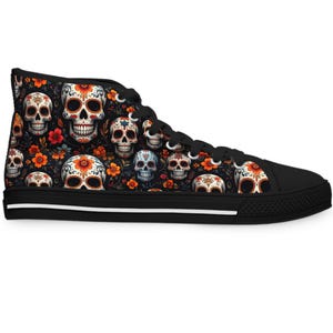 May include: High-top canvas trainer with a black base, patterned with colourful sugar skulls and flowers. The shoe has a black sole with a white stripe and black laces.