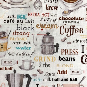 May include: A beige fabric background with a variety of coffee-themed illustrations and text. The text includes "PRESS", "Nitro brew", "EXTRA HOT", "1/4 C", "half caf", "chocolate mocha", "Coffee", "BLOND", "mix with water", "1/4 C", "half caf", "GRIND", "2 tbs", "BLOND", "Latte", "Add", "milk half and half", "I love Coffee", "decaf". The illustrations include a coffee pot, a coffee cup, coffee beans, and a milk carton.