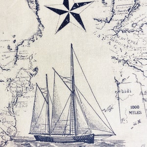 May include: A blue and white nautical themed fabric with a vintage map design, a sailboat, and a five-pointed star.