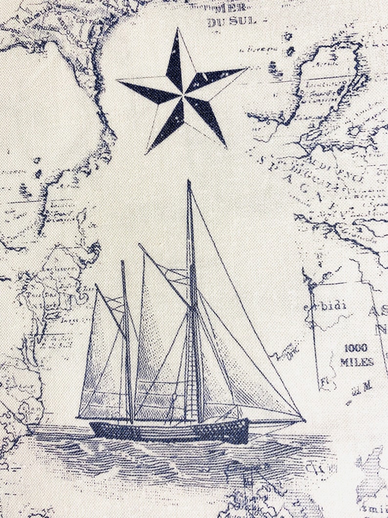 May include: A blue and white nautical themed fabric with a vintage map design, a sailboat, and a five-pointed star.