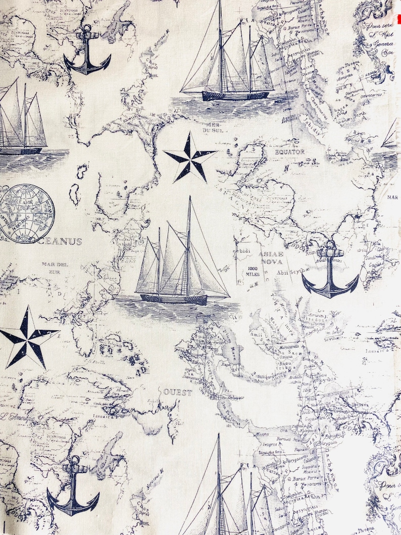 May include: A vintage nautical themed fabric with a white background and blue illustrations of ships, anchors, stars, and a map. The map includes the words "OCEANUS", "MAR DEL ZUR", "EQUATOR", "ABIAE NOVA", "1000 MILES", "Abri Scy", "SOUEST", and "MAR".