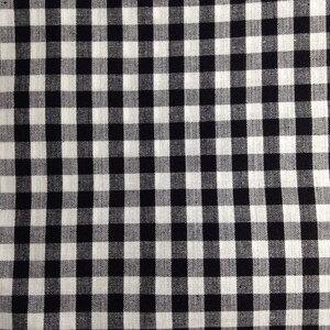 May include: Black and white checkered fabric with a woven texture.