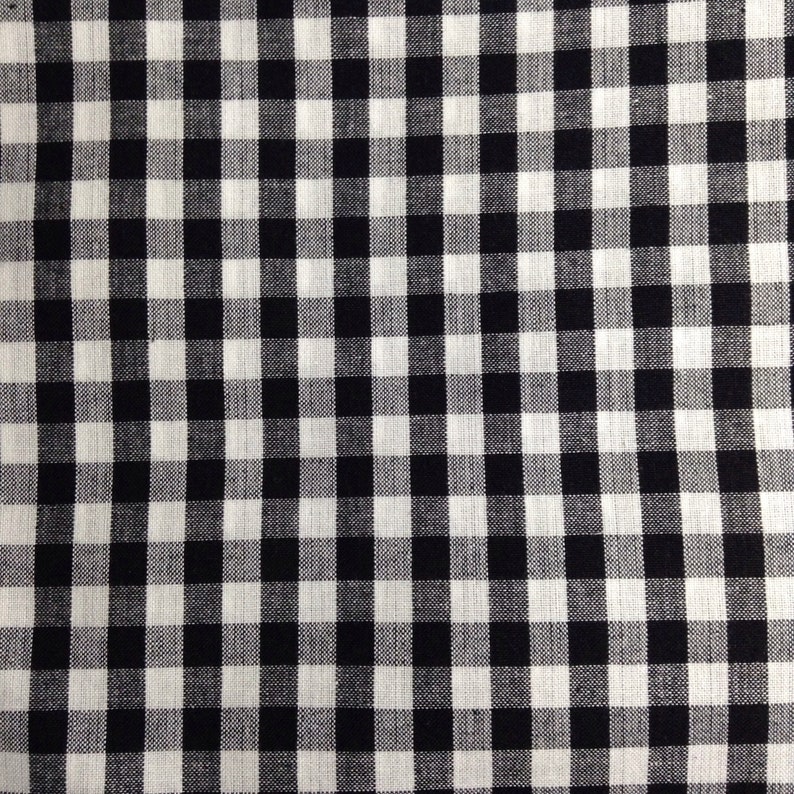May include: Black and white checkered fabric with a woven texture.