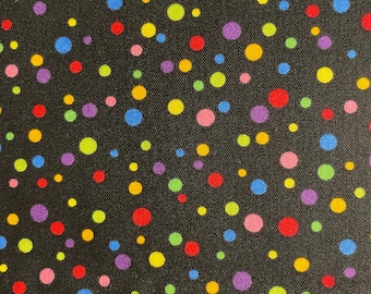 May include: Black fabric with a repeating pattern of colorful polka dots in red, yellow, blue, green, pink, and purple. The dots vary in size and are scattered across the surface.